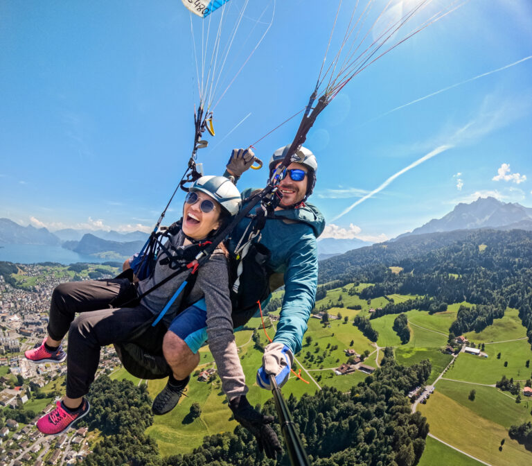 Tandem paragliding over Lake Lucerne area with wide valley views